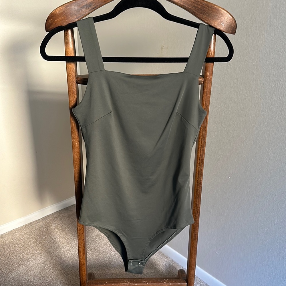 Green bodysuit with button closure